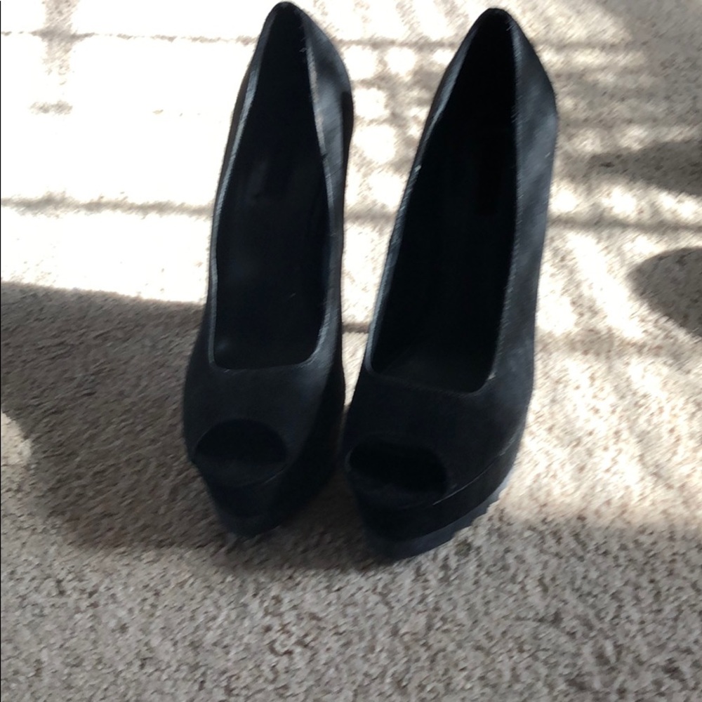 Six inch black suede stiletto pumps